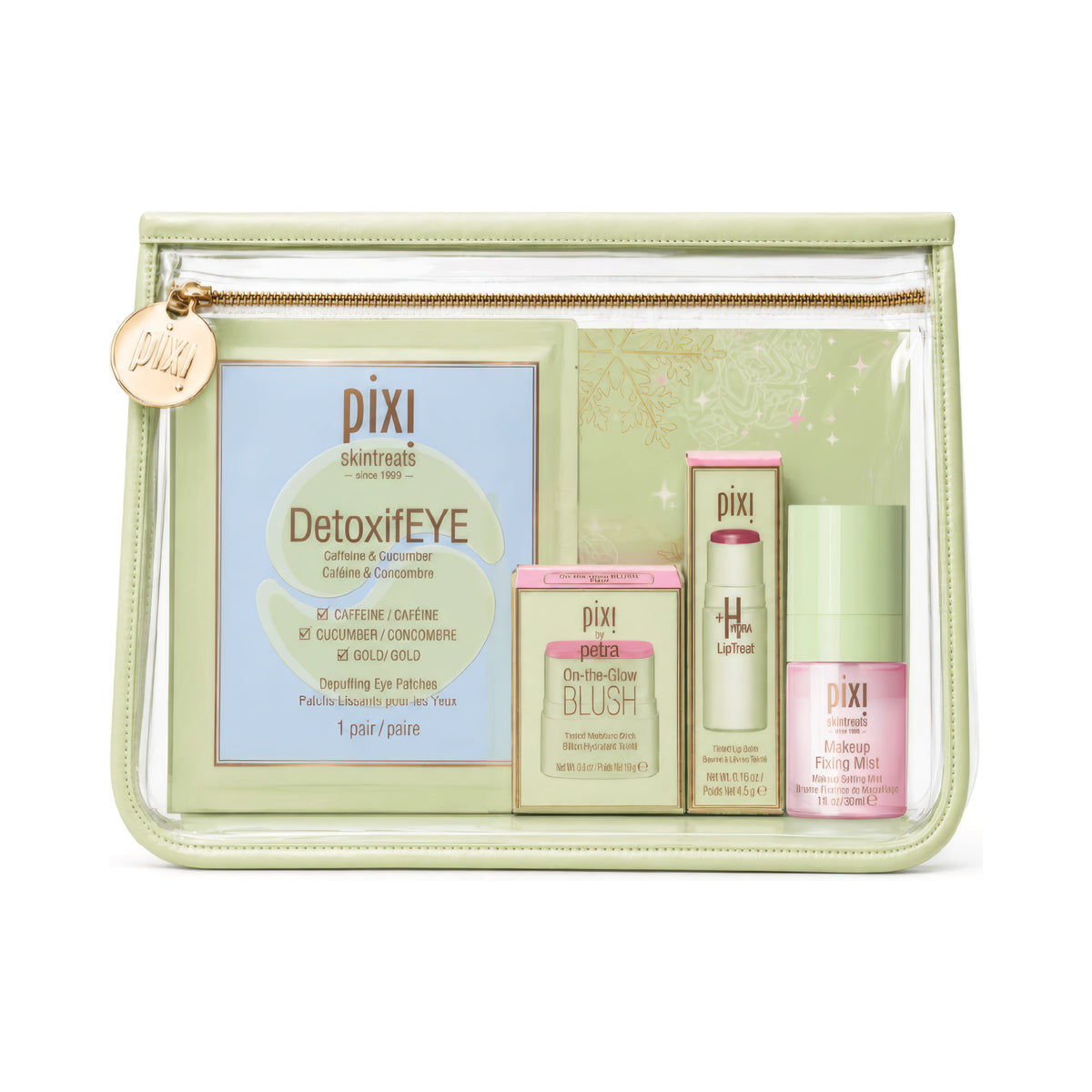 A clear zippered cosmetic pouch with a pale green border and gold zipper, containing Pixi skincare products including DetoxiEYE, Blush, and All-In-One Fixing Mint on a white background.