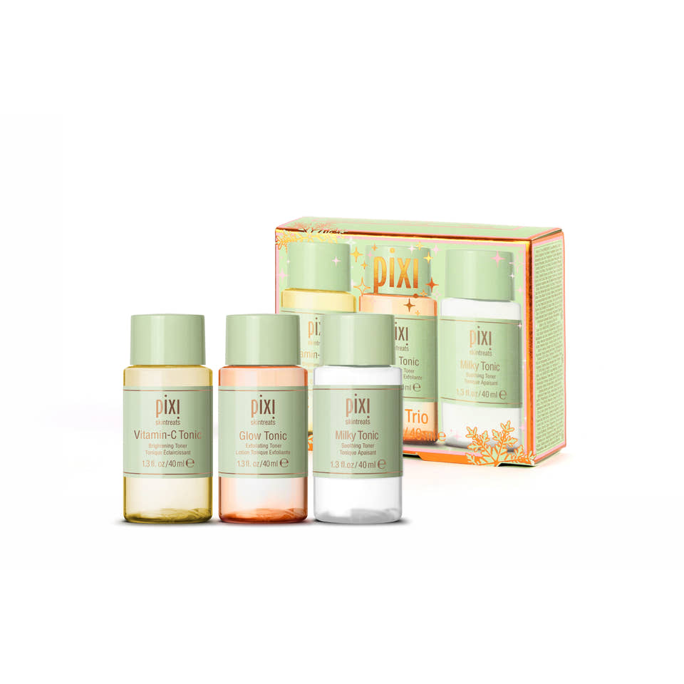 Pixi Trio Tonic set featuring three small tonics Vitamin-C Tonic, Glow Tonic and Milky Tonic bottles with pale green caps in front of a matching light green and orange box on a white background. view 1
