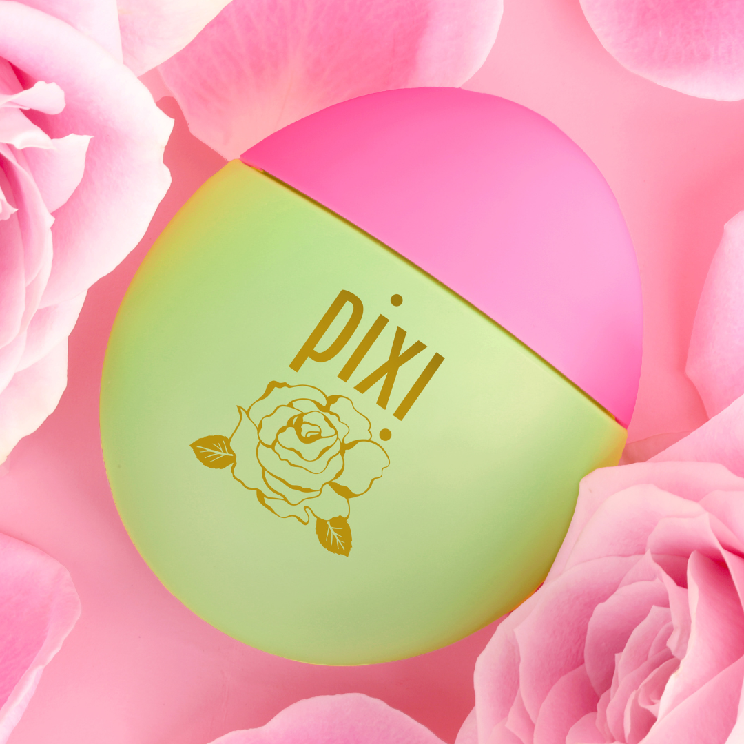 HandHero in PixiRose scent shown on a pink background with roses