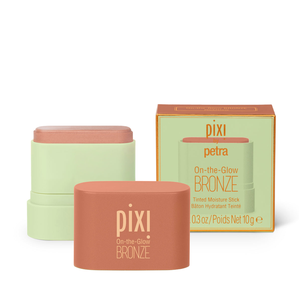 Pixi Petra On-the-Glow Bronze tinted moisturizer shown with the product stick in a matte terracotta container, a stacked set of two sticks, and its matching light green and gold packaging box on a white background.