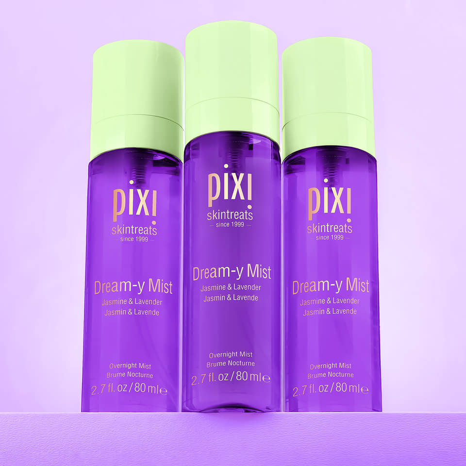 Three bottles of Pixi Dream-y Mist on a purple background view 2
